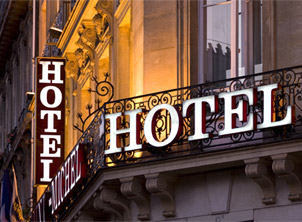 Illuminated Parisian hotel sign