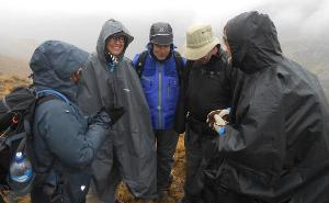 Team huddled on trek to Machu Picchu